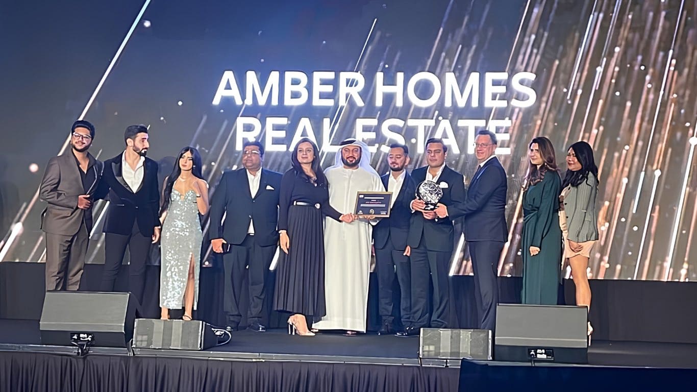 Amber Homes Real Estate team receiving Platinum Agency 2022 from Meraas, Nakheel & Dubai Holding