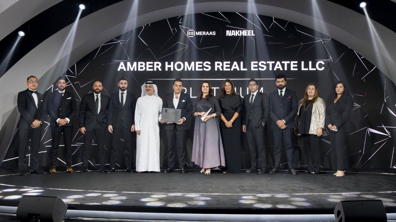 Ambreen Qureshi and the Amber Homes Real Estate team on stage — Platinum Agency 2024