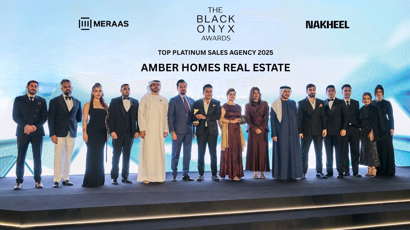 Amber Homes Real Estate team receiving Platinum Agency 2025 from Meraas, Nakheel & Dubai Holding